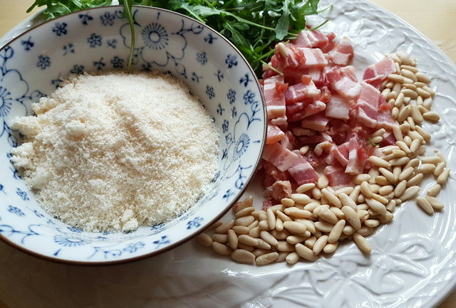 baked passatelli with pancetta and pine nuts