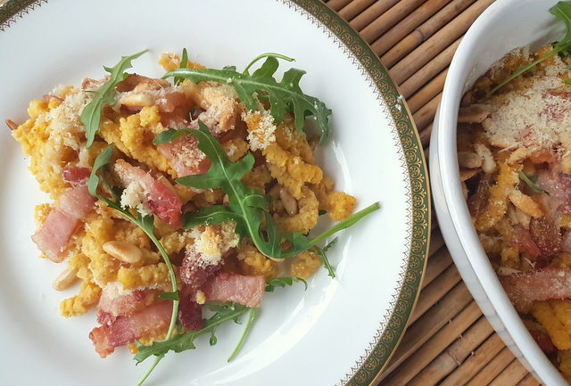 baked passatelli with pancetta and pine nuts