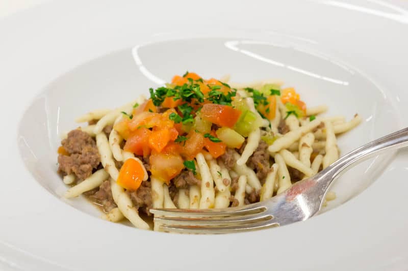 Strozzapreti with meat sauce and vegetables