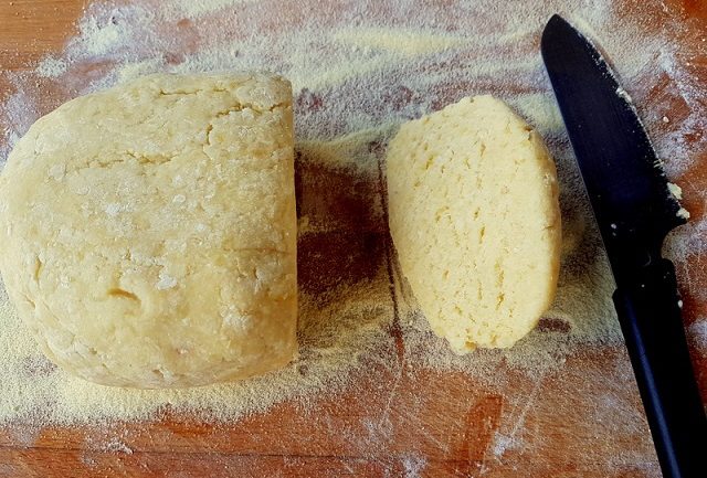 dough for homemade Italian potato gnocchi on wooden board