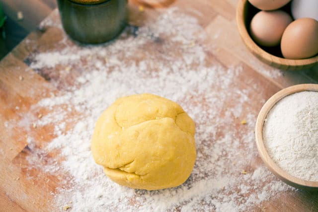 Homemade lasagne pasta dough on wooden board