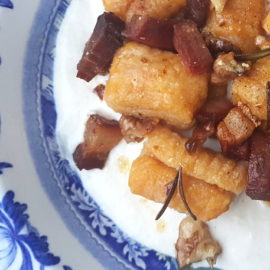 Pumpkin gnocchi with speck and walnuts