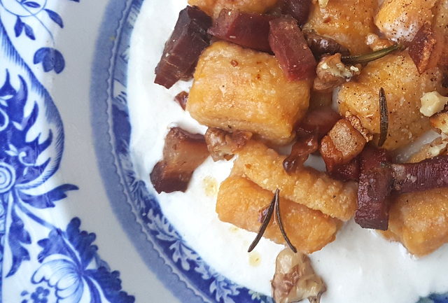 Pumpkin gnocchi with speck and walnuts 