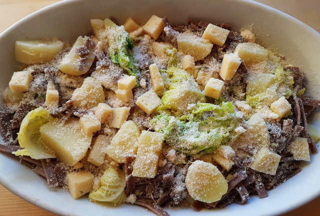 pizzoccheri alla Valtellinese in white oven dish before baking