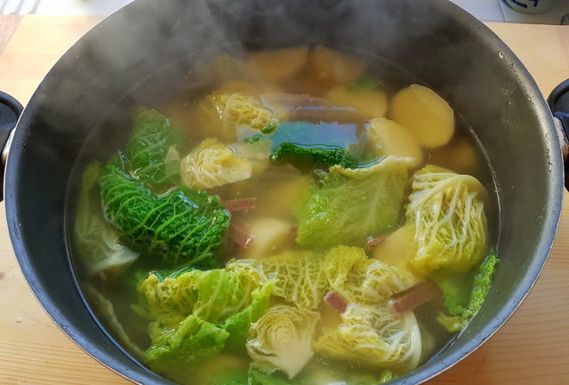potatoes, chard and pizzoccheri cooking in boiling water