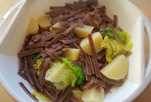 potatoes, chard and pizzoccheri drained in colander