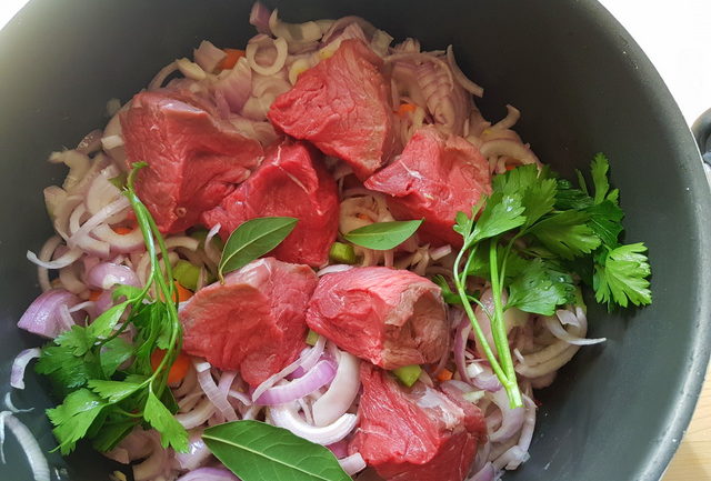 Ingredients for la Genovese ragu in cooking pot