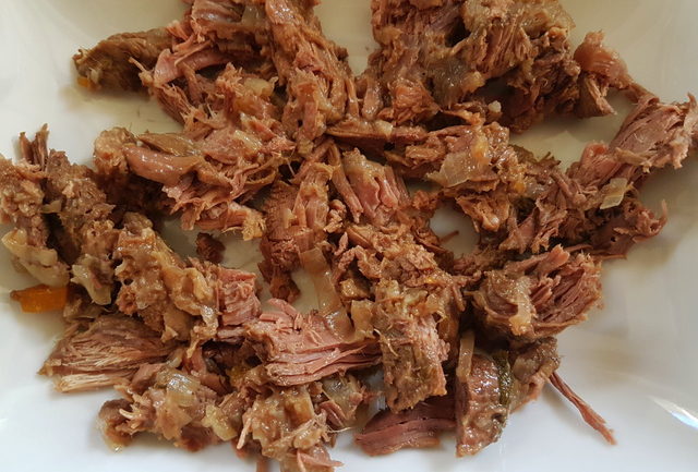 shredded beef on white plate