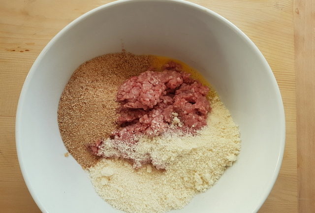 ingredients for veal meatballs in white bowl