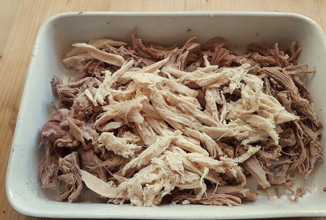 shredded chicken and veal in white bowl