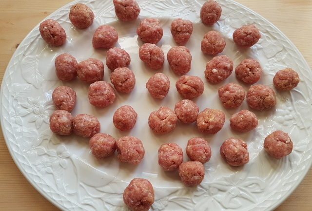 small veal meatballs on white plate