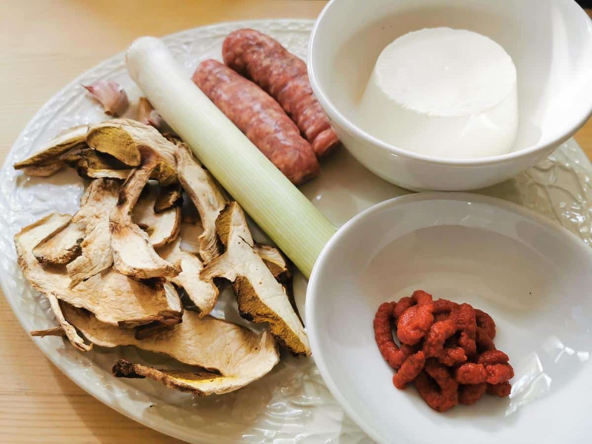 Ingredients for baked stuffed paccheri with sausage and mushrooms