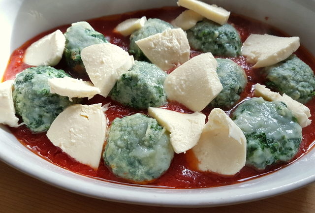 Baked Tuscan gnudi (Malfatti) with homemade tomato sauce and mozzarella