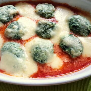 Baked Tuscan gnudi (Malfatti) with homemade tomato sauce and mozzarella