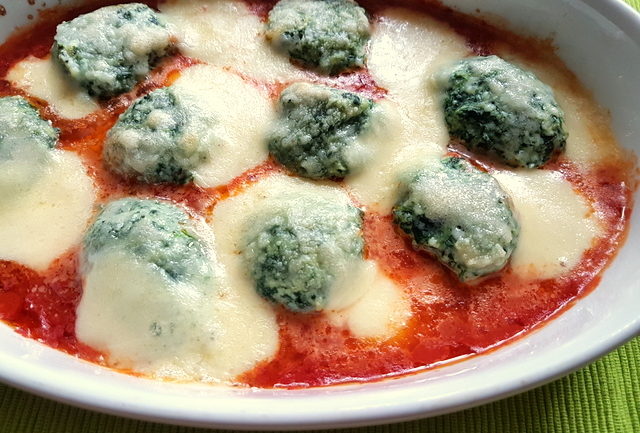 Baked Tuscan gnudi (Malfatti) with homemade tomato sauce and mozzarella