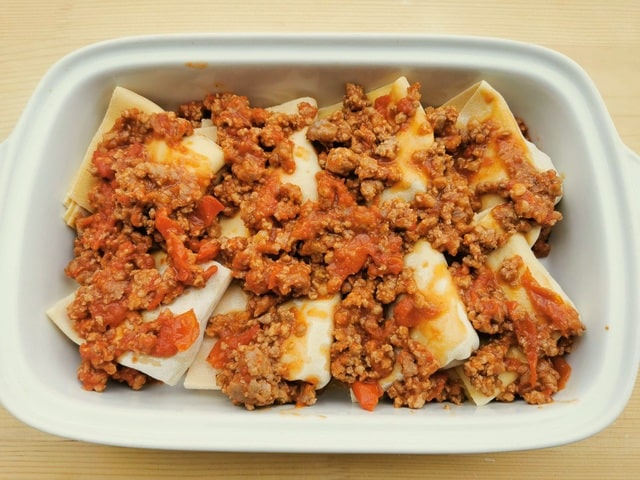 fregnacce abruzzesi in white oven dish ready to be baked