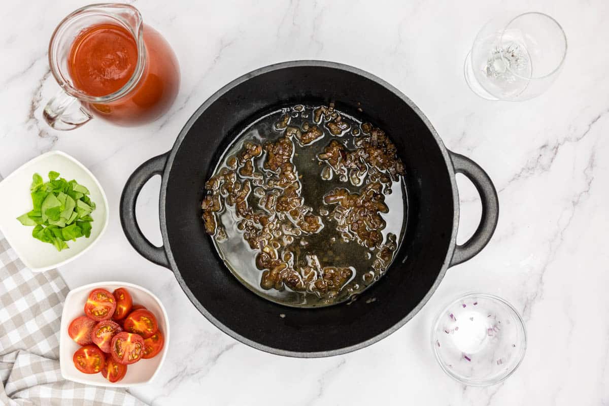 Deglazing the dutch oven with white wine