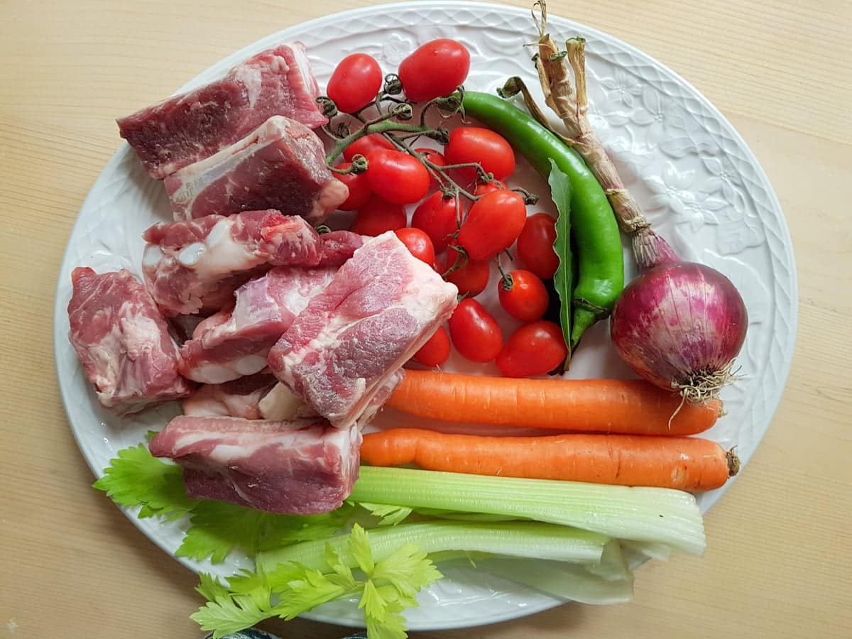 ingredients for braised pork short ribs on white plate