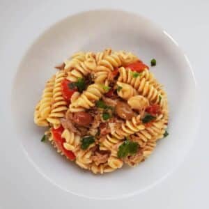 Black olive pesto with pasta in a bowl