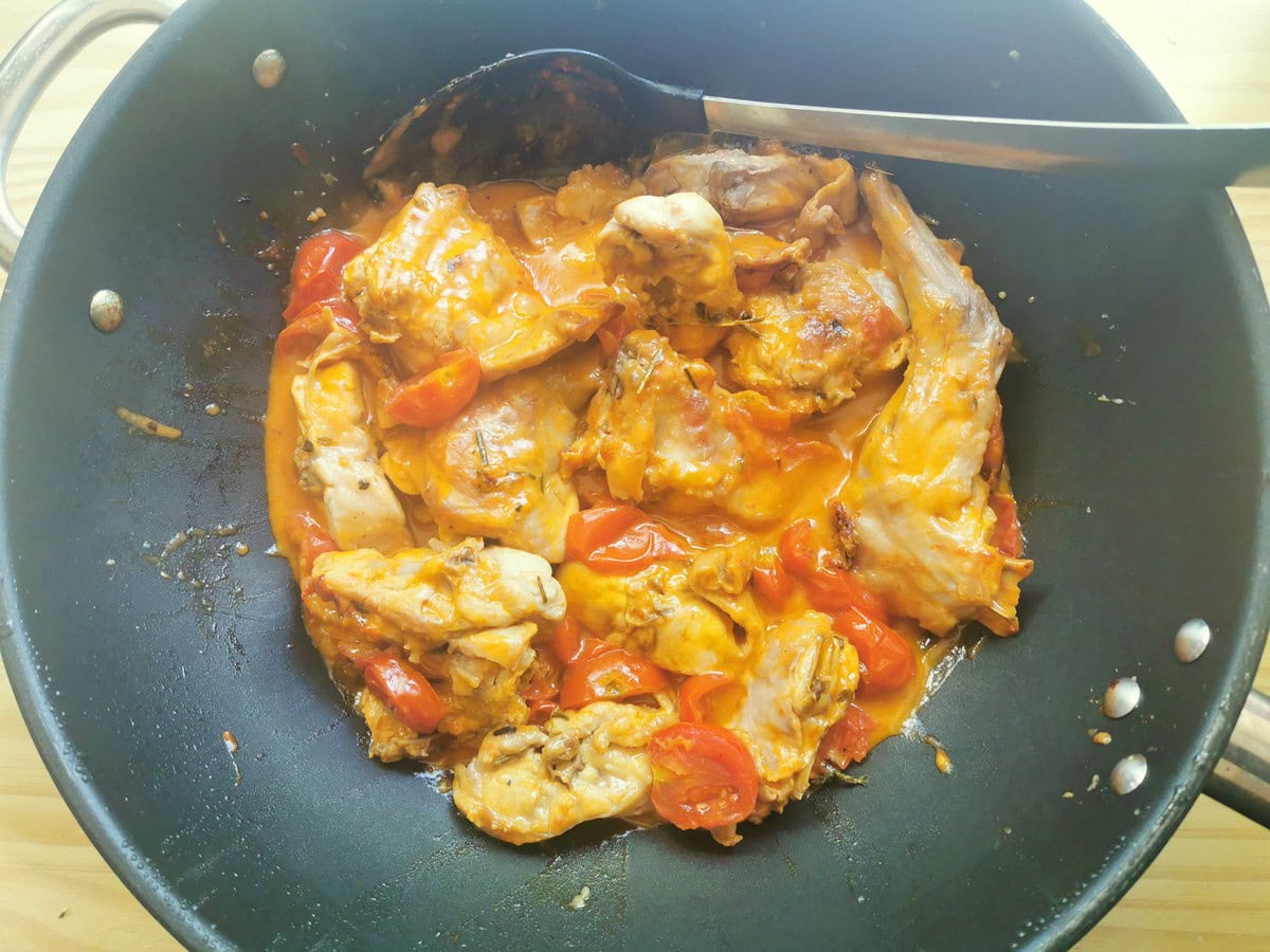 Ready braised rabbit in deep skillet.