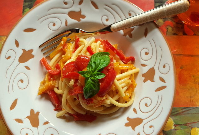 Bucatini with red and yellow cherry tomatoes and peppers