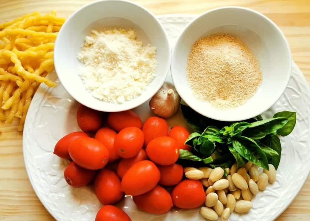 ingredients for Trapanese pesto on white plate