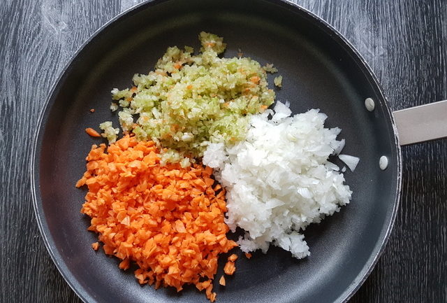 finely chopped carrots, celery and onions in frying pan