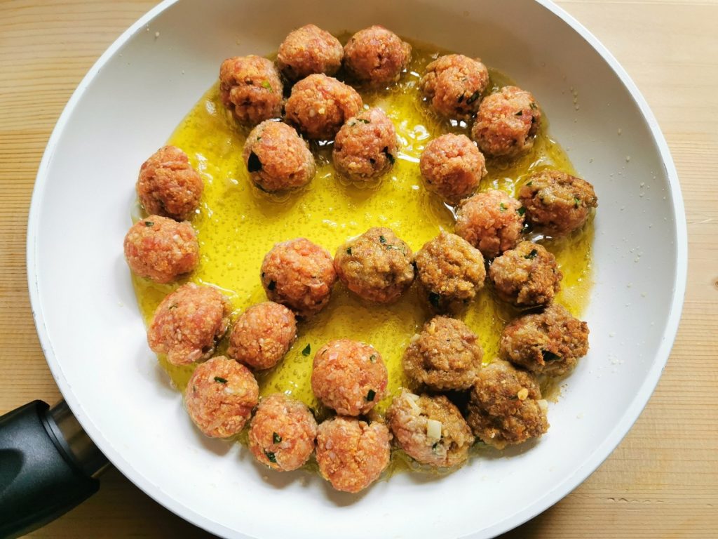 meatballs cooking in frying pan