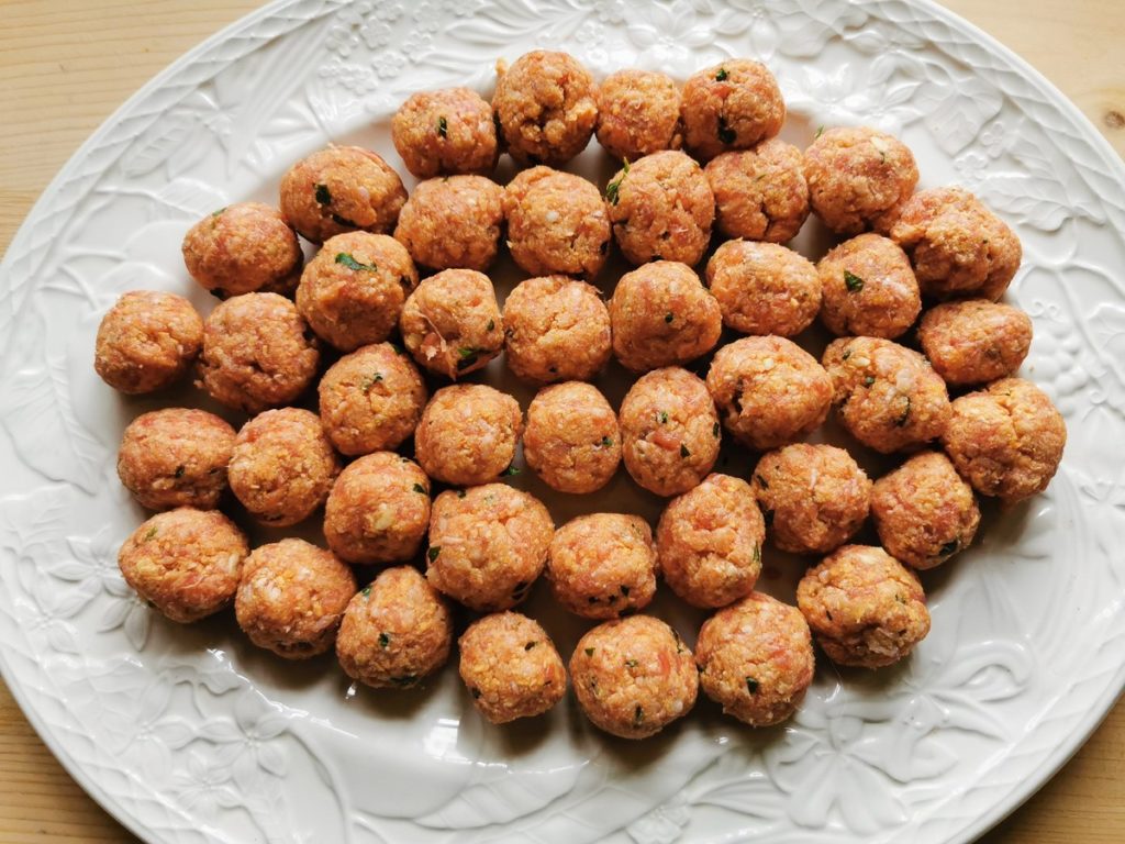 ready rolled meatballs on white plate