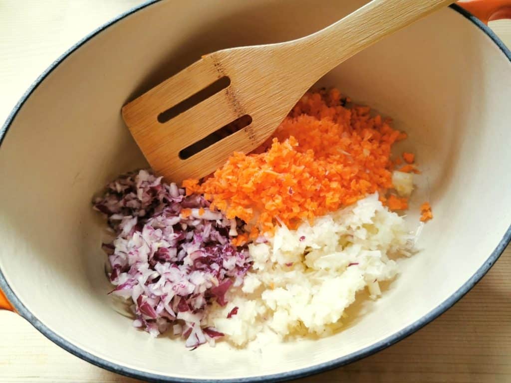 chopped onions, carrots and celery in Dutch oven