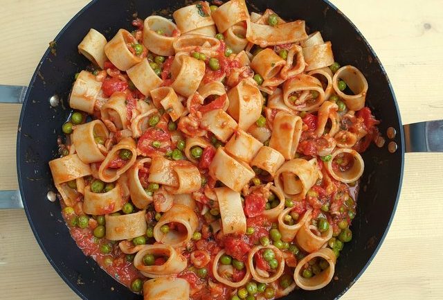 Calamarata pasta with stewed cuttlefish and peas