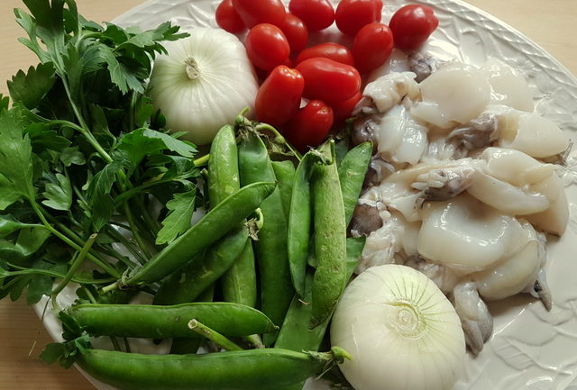 ingredients for calamarata pasta with stewed cuttlefish and peas 