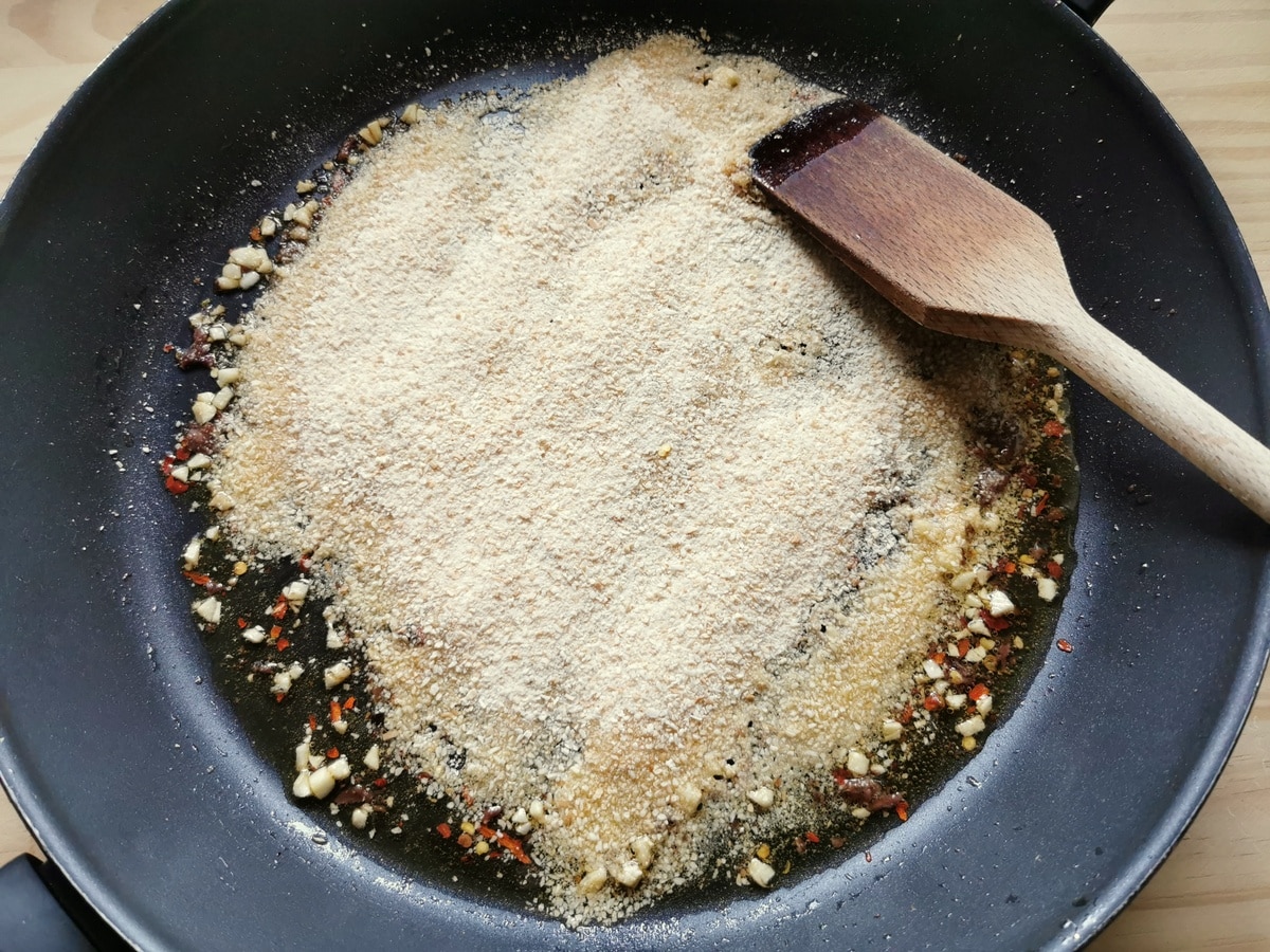 Breadcrumbs added to the oil and chili.