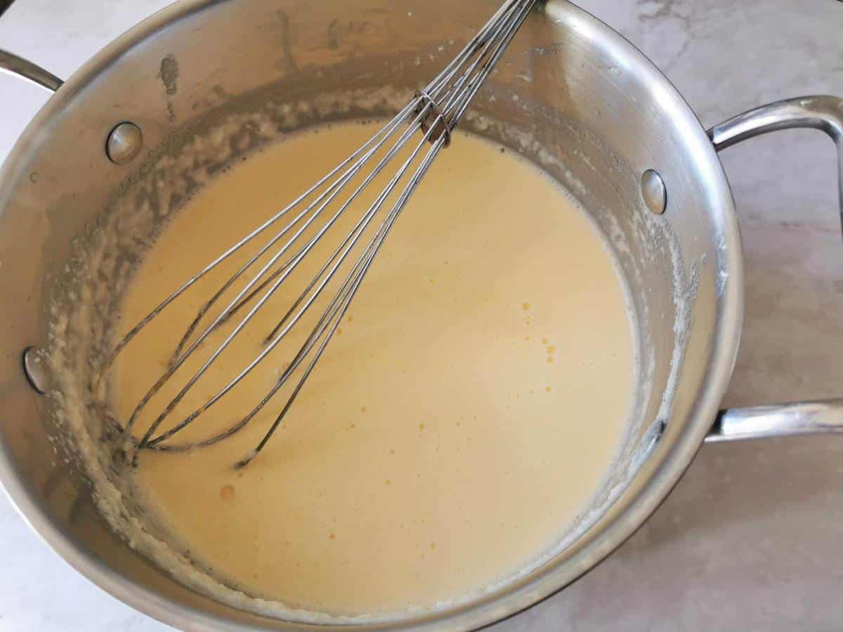 Thick cheese sauce in pan ready to refridgerate. 