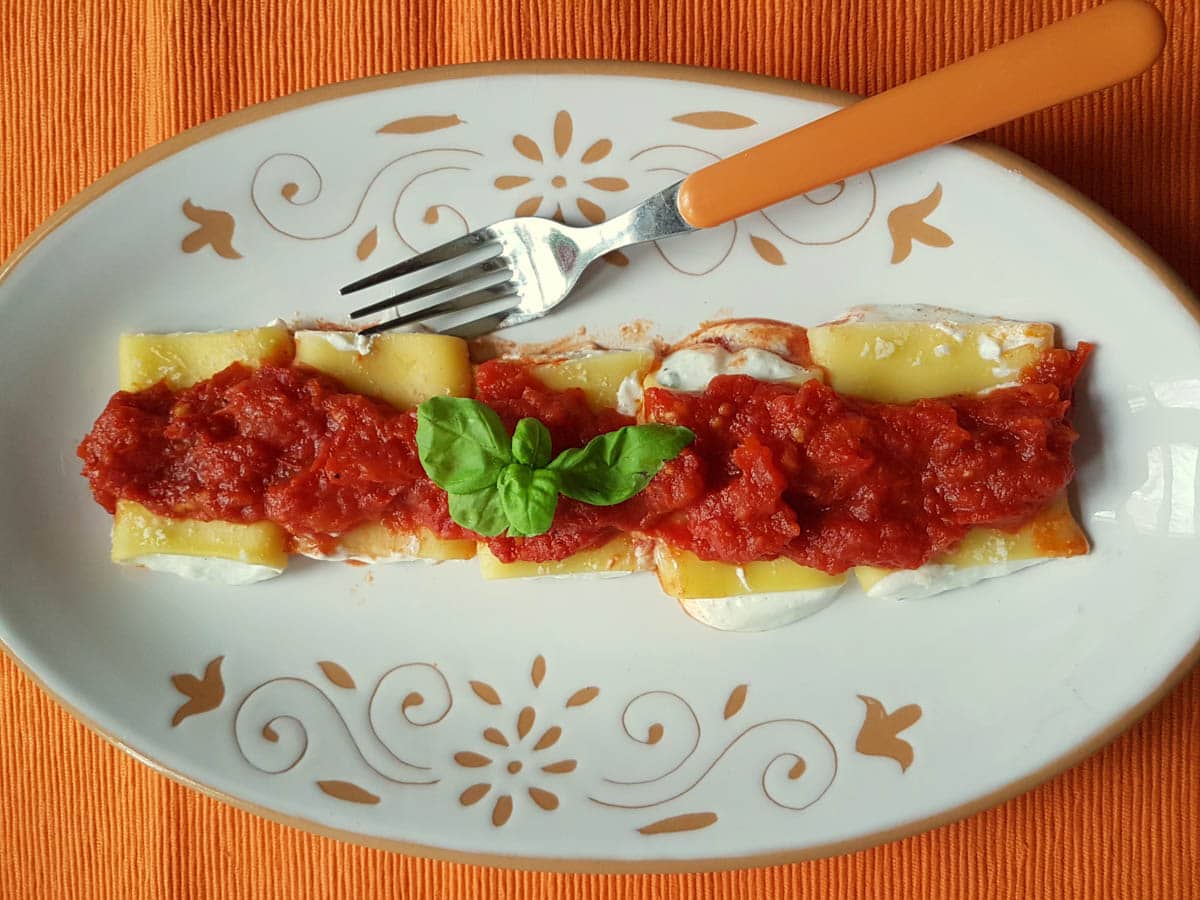 Ricotta and basil filled paccheri pasta.