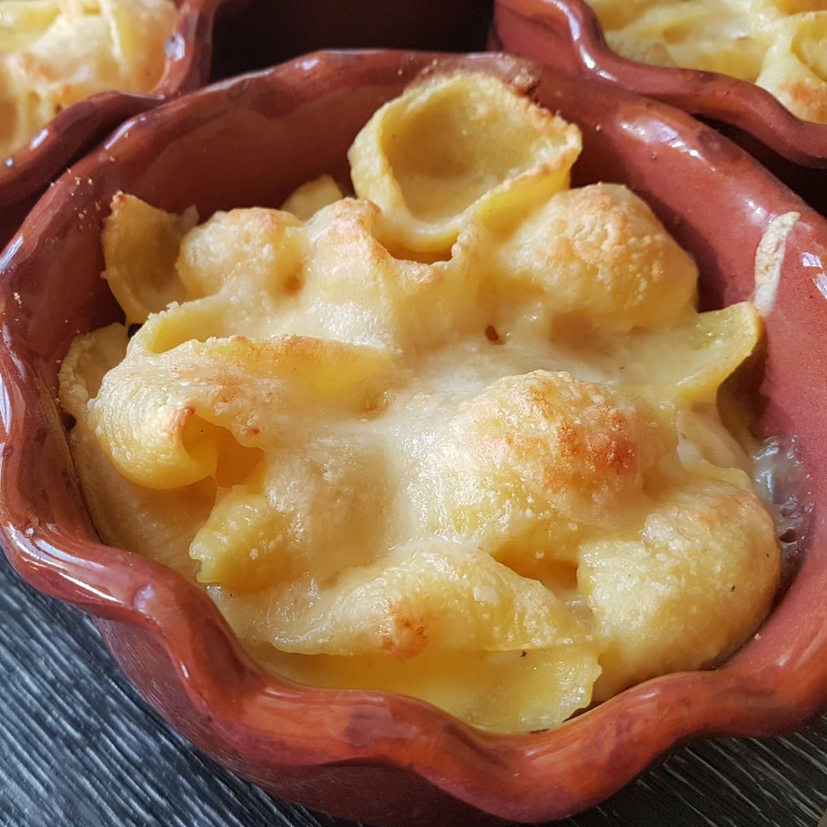 Cheesy conchiglie pasta al forno (baked pasta shells).