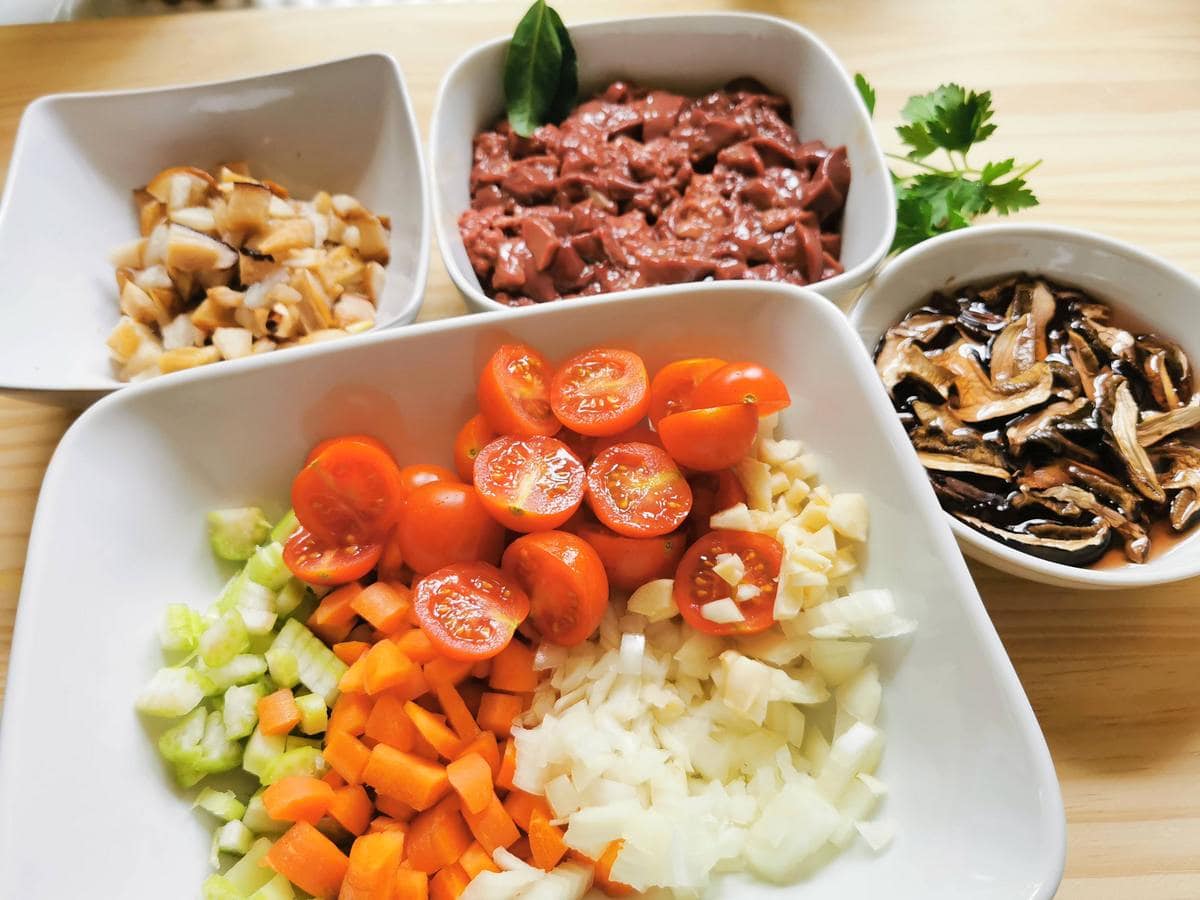 ingredients for chicken liver and porcini ragu chopped and ready to cook