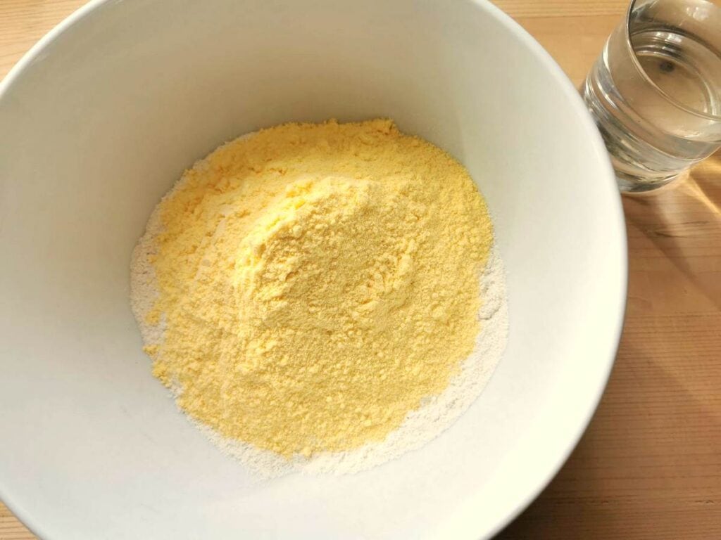 corn and wheat flour in large white bowl