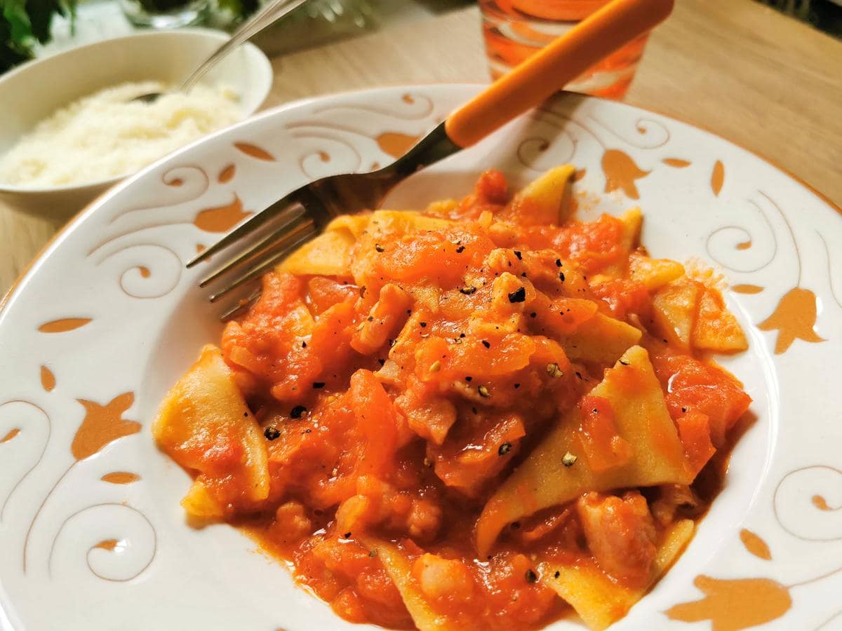 Homemade corn and wheat flour pasta triangles with pancetta. Recipe from Abruzzo