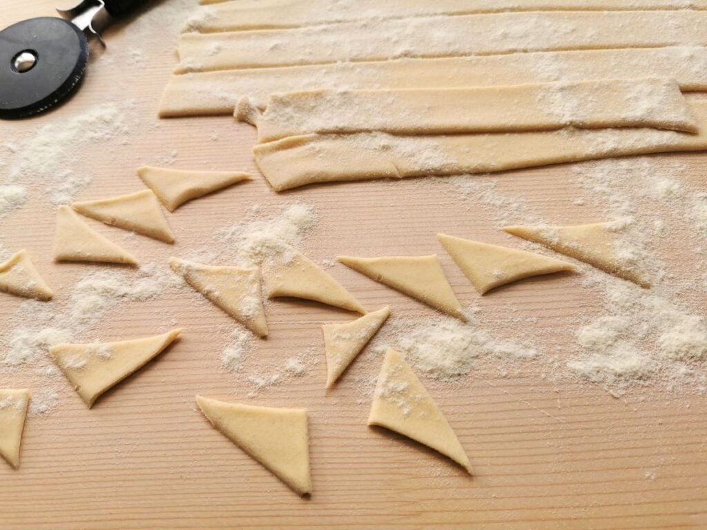 pasta dough strips cut into triangles