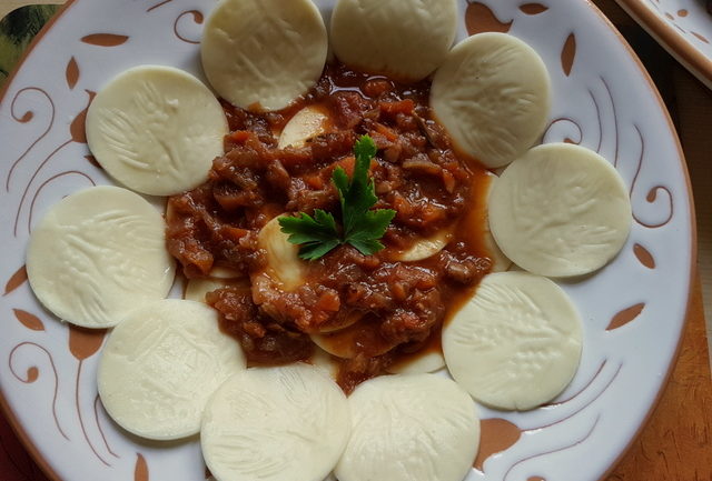 Corzetti or Croxetti pasta with tocco di carne genovese sauce