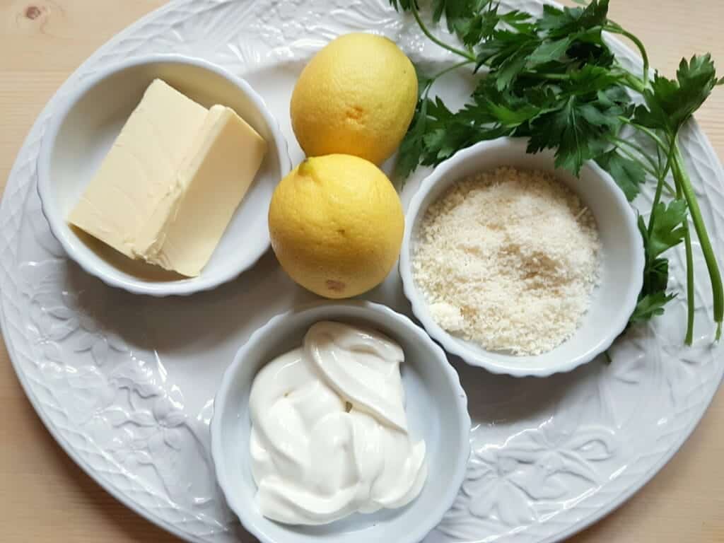 ingredients for lemon pasta sauce on white plate