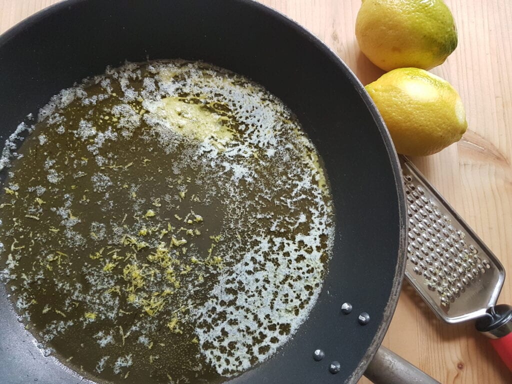 lemon zest in skillet with melted butter