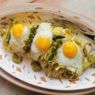 Creamy asparagus spaghetti with fried quail eggs.