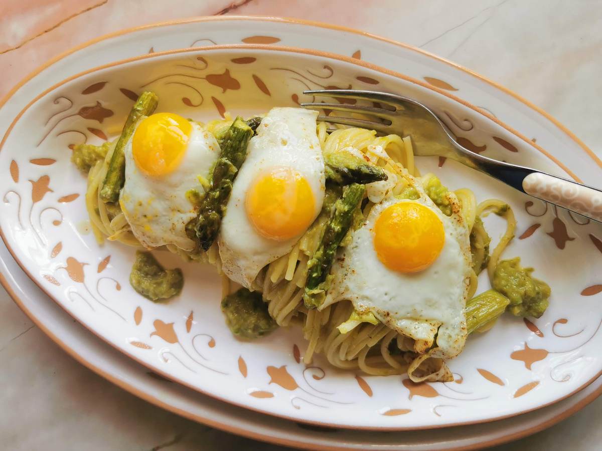 Creamy asparagus spaghetti with fried quail eggs.