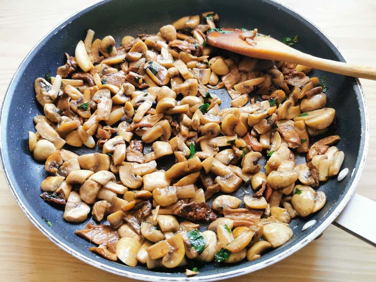 Ready cooked mushrooms in skillet.