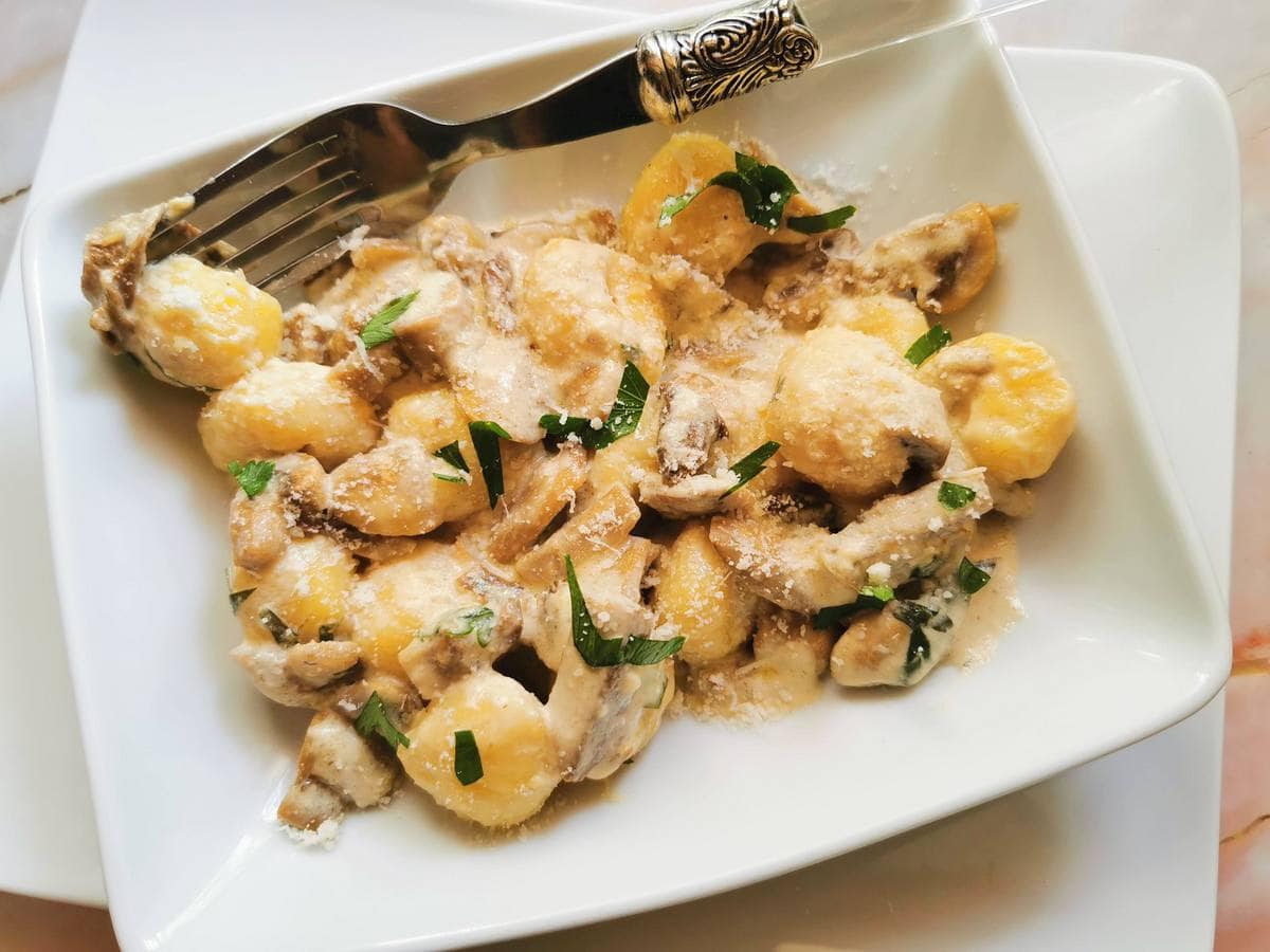 Creamy mushroom gnocchi with stracchino crescenza.