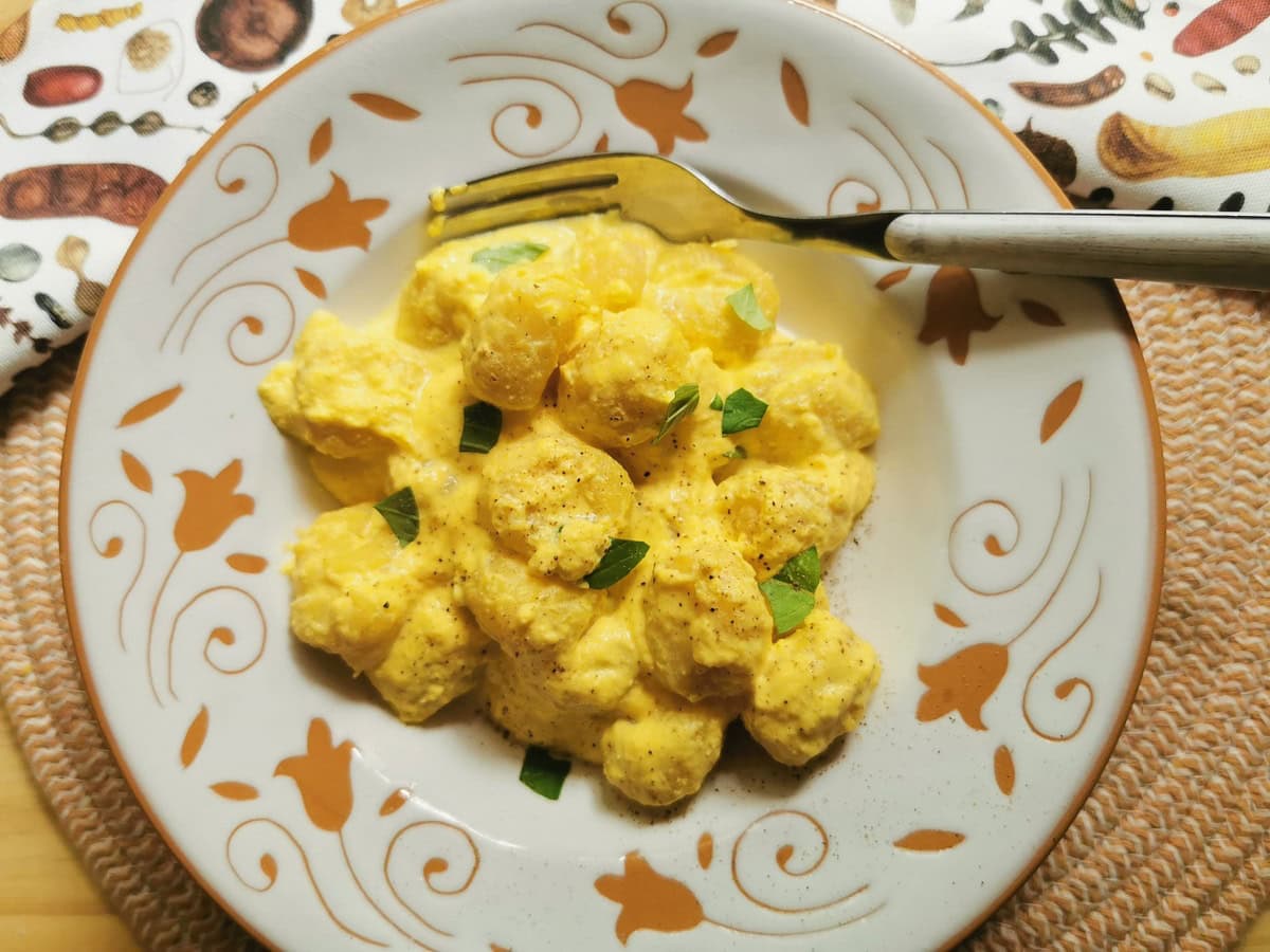 Creamy potato gnocchi with saffron sauce.