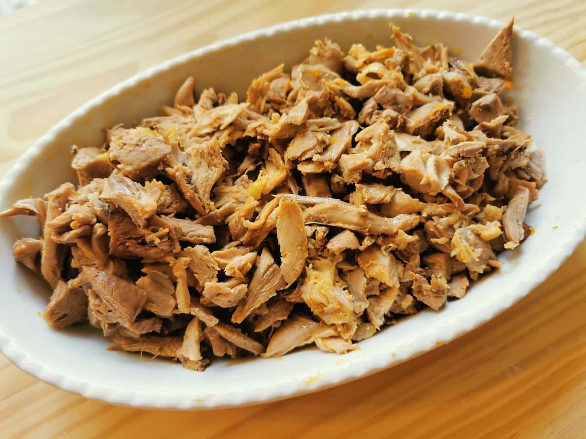 Shredded duck in a bowl.