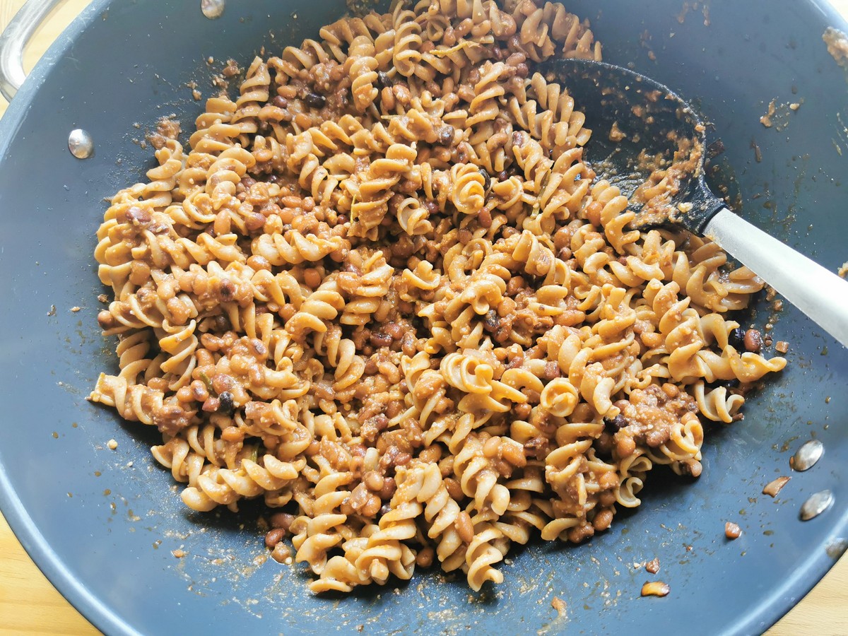 Ready to serve high protein pasta with Trasimeno beans in deep frying pan.